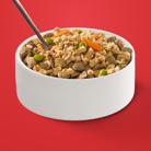 Purina ONE fresh dog food mixed with dry kibble in a white bowl.