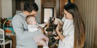 Couple with a baby and a cat