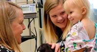 two women holding baby at childrens hospital in saint louis