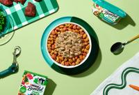 Overhead look at a bowl of Dry kibble topped with Beneful Freshly Prepared wet food.