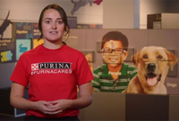 Purina Farms staff member in front of the interactive curriculum at Purina Farms visitor center