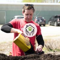 A Purina employee helps plant trees in partnership with Forest ReLeaf in Missouri.