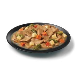 Purina Pro Plan Complete Essentials turkey and vegetables wet dog food in a dish