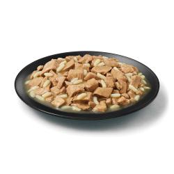 Purina Pro Plan Complete Essentials adult 7 plus beef and rice senior wet dog food in a dish