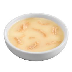 Friskes Bits n Broth chicken flavored cat food topper in bowl