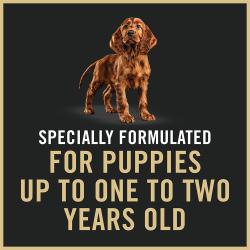 Dog food package label highlighting specially formulated for puppies up to one or two years old.