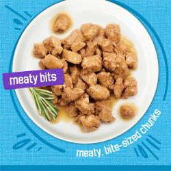 Friskies Meaty Bits with ocean fish in sauce wet cat food in a bowl with meaty bit sized chunks.
