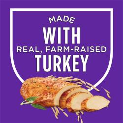 A shield sits on a purple background with text that reads "made with real, farm-raised turkey." A photo of sliced turkey breast with herbs and grains sit below the shield