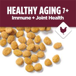 Image of dry cat food kibble on a white background. A maroon banner with text reads "Healthy Aging 7+ Immune and Joint Health" accompanied by an icon of a chicken