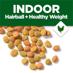 Image of dry cat food kibble on a white background. A green banner with text reads "Indoor Hairball + Healthy Weight" accompanied by an icon of a chicken