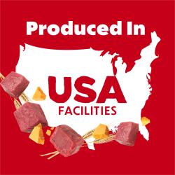 Carne de vacuno cruda, queso y trigo rodean un contorno del mapa de EE. UU. con el texto: Producido en instalaciones de EE. UU.