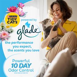 A smiling woman holding a cat with a Tidy Cats powered by Glade logo and text, powerful 10 day odor control.