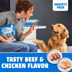 Woman feeding a variety pack beef and chicken Purina DentaLife Daily Oral Care dog treat to her golden retriever.