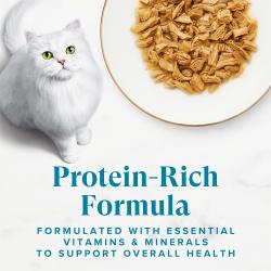 Fancy Feast Grilled Ocean Whitefish and Tuna Feast wet cat food with white cat; protein-rich with vitamins and minerals.
