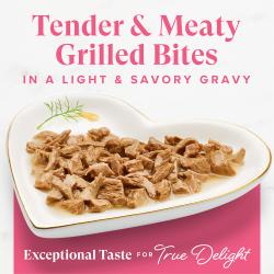 Fancy Feast Grilled Salmon and Shrimp Feast wet cat food tender meaty bites in light savory gravy on a heart-shaped plate.