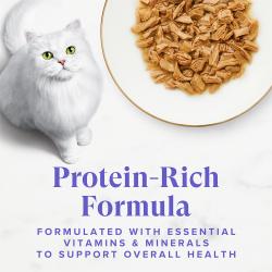Fancy Feast Grilled Seafood Feast wet cat food in gravy with white cat; protein-rich formula with vitamins and minerals.