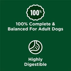 A green squiggly badge shows 100%. Text accompanying it reads "100% complete and balanced for adult dogs." Below, another green squiggly badge shows an illustrated stomach. Accompanying text reads "highly digestible"A green squiggly badge shows 100%. Text accompanying it reads "100% complete and balanced for adult dogs." Below, another green squiggly badge shows an illustrated stomach. Accompanying text reads "highly digestible"
