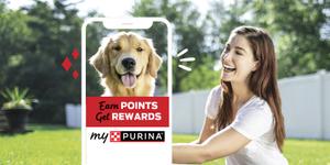 A woman smiling at her happy dog outlined by a phone promoting “Earn points, get rewards, myPurina”