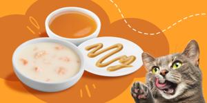 A cat excitedly licking its lips looking at lickable cat treats.