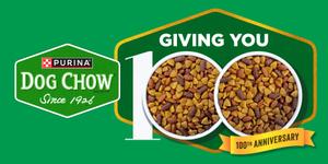 The left side of the image show the Purina Dog Chow logo. The rightside show a green and gold badge with text that reads "giving you 100 anniversary." The zeros in 100 are bowls of dry dog food kibble.