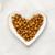 Fancy Feast Kitten dry food plated on a heart-shaped dish