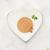 Fancy Feast Gourmet Naturals wet kitten food plated on a heart-shaped dish