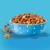 A bowl of Purina Puppy Chow on a light blue background