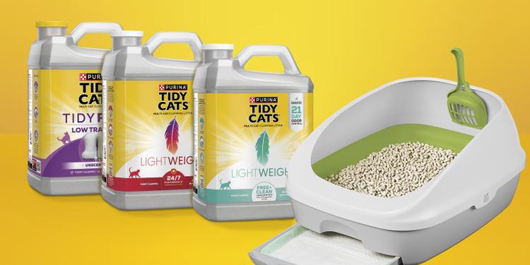 Variety of Tidy Cats jugs next to a Breeze litter box system.