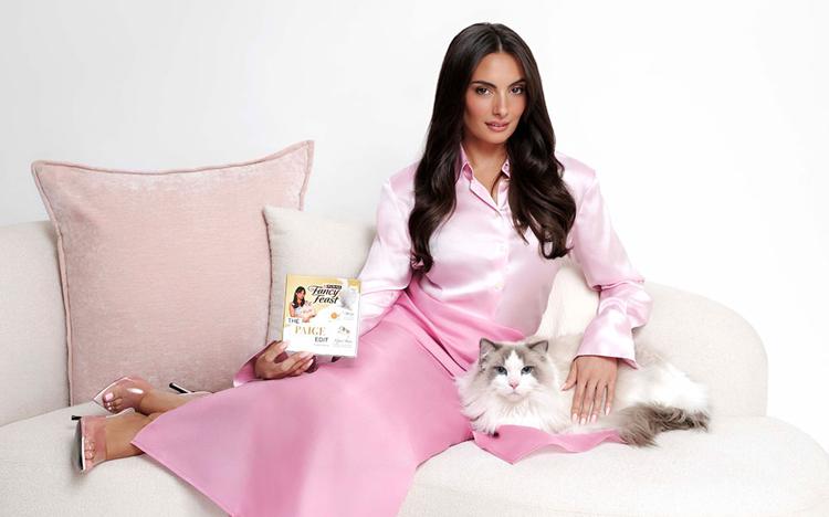 Paige Desorbo and her cat, Daphne, with a box of The Paige Edit.
