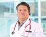 Dr. Kurt in white lab coat