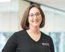 Dr. Melanie in black shirt with Purina logo