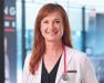 Dr. RuthAnn in white lab coat