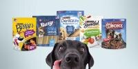 A dog looking at a dog food package