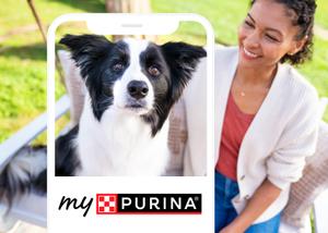 A woman smiling with a dog