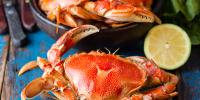 cooked crab in bowl and on table