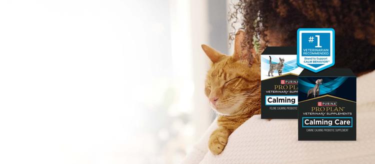 A person hugging a cat behind packages of canine and feline Pro Plan Veterinary Supplements Calming Care with #1 veterinarian recommended callout