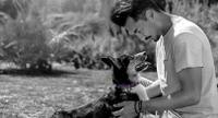 Man holding a dog
