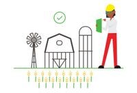 A woman wearing a hard hat and holding a green paper