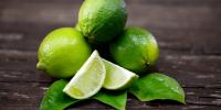 limes and lime wedges on table