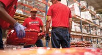 A group of Purina employees in a warehouse