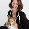 Karie Johnson, DVM holding a sheltie dog