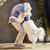 person hugging white service dog