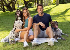 JoJo Fletcher and Jordan Rodgers sitting with their dogs and a pouch of Prime Bones dog treats