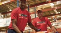 men loading dog food