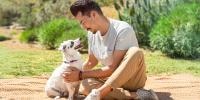 man and dog playing