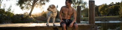 Person on a dock with their dog
