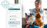 Woman on couch finding the right dog food for her dog and cat, who are sitting on her lap