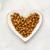 Fancy Feast Kitten dry food plated on a heart-shaped dish