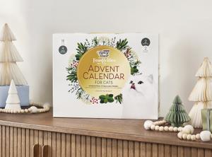 Fancy Feast Advent calendar on a shelf decorated for the holidays