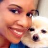 Callie Harris, DVM next to a white dog